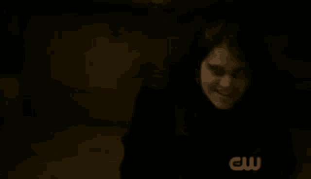a dark background with a cw logo on the bottom right