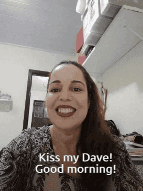 a woman says " kiss my dave good morning " on her face