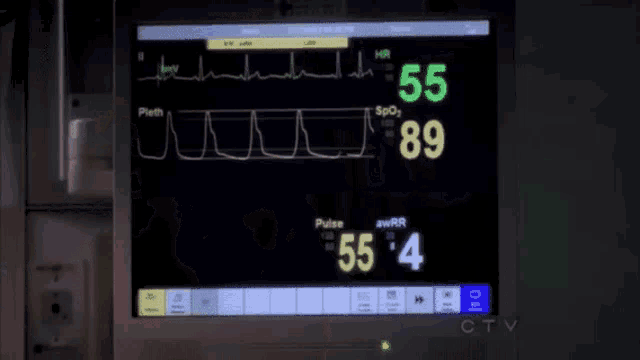 a man is laying in a hospital bed with his eyes closed and a ctv logo in the background