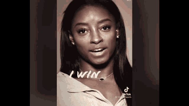 a black and white photo of a woman with the words " i win " written on it