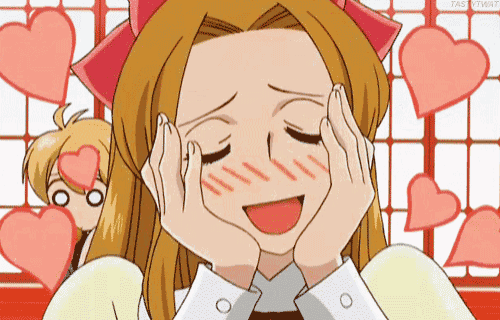 a cartoon girl with her hands on her face is surrounded by hearts .