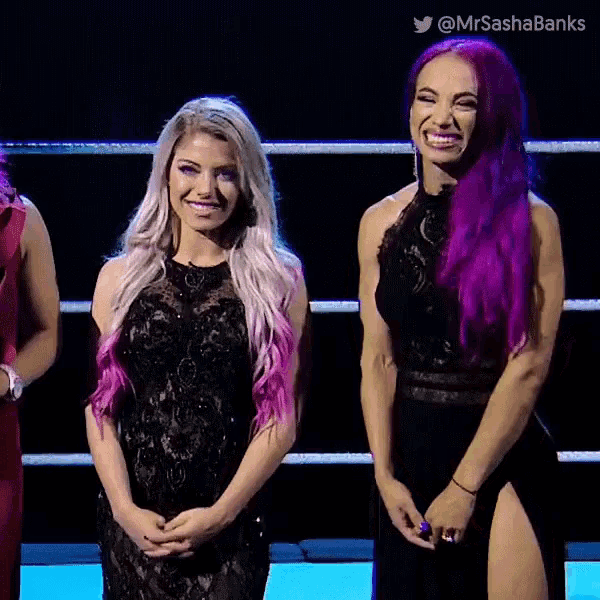 two women with purple hair are standing next to each other and smiling ..