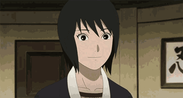 a girl with short black hair is smiling in front of a picture with chinese writing on it