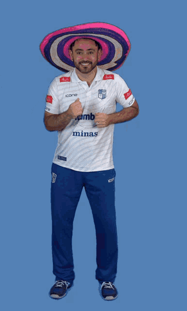 a man wearing a sombrero and a white shirt that says itamb kings