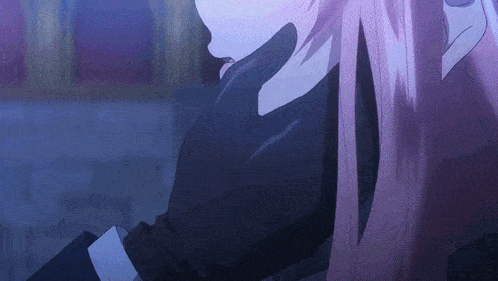 a close up of a person 's face with purple hair