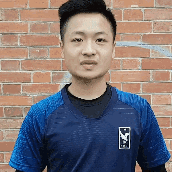 a man wearing a blue shirt with the letters sbu on it