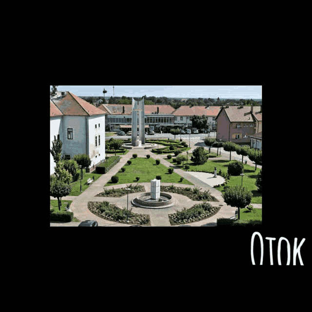 an aerial view of a circle of people holding hands in front of a building with the word otok on the bottom