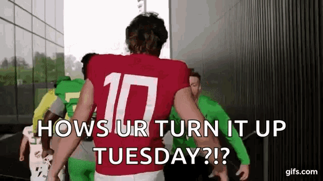 a football player in a red jersey with the number 10 on it