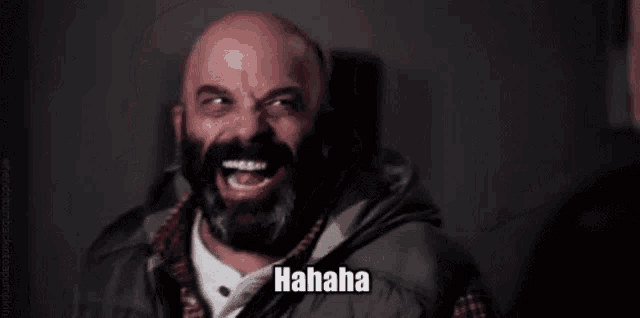 a bald man with a beard is making a funny face and saying no .