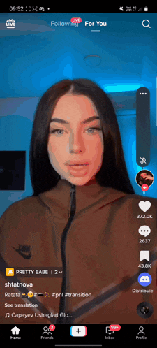 a screenshot of a woman 's face on a phone with a following for you button