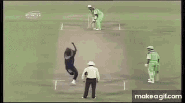 a blurred image of a man in a blue india jersey
