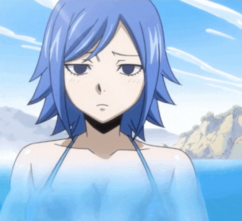 a girl with blue hair is standing in the water with mountains in the background