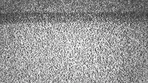 a black and white photo of a gray carpet with a grainy texture .