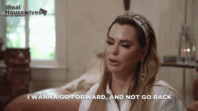 a woman says " i wanna go forward and not go back " while wearing a tiara