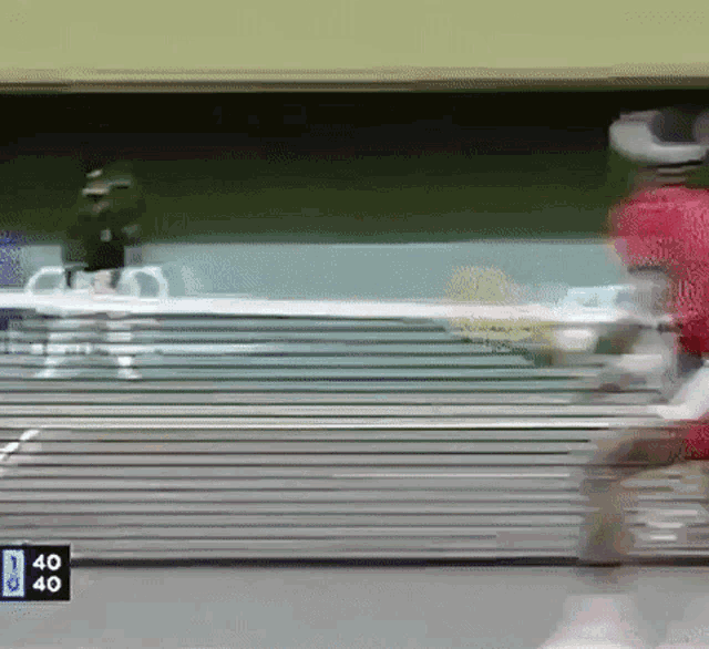 a blurry picture of a person running with the number 40 on the bottom right