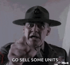 a man in a military uniform and hat is pointing at the camera .