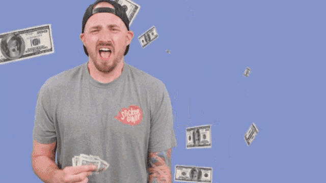 a man is holding money in front of a sign that says " show me the "