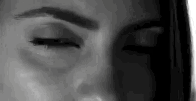 a close up of a woman 's face with her eyes closed and her eyebrows visible .