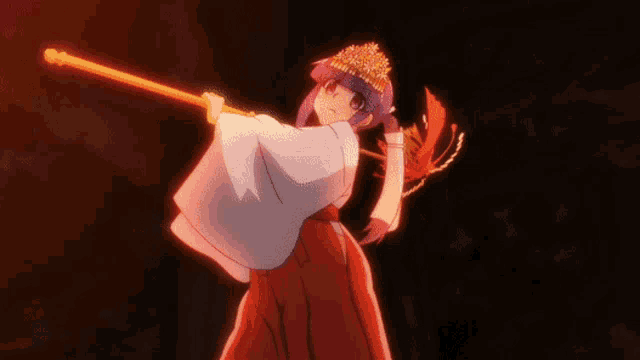 a girl in a kimono is holding a sword