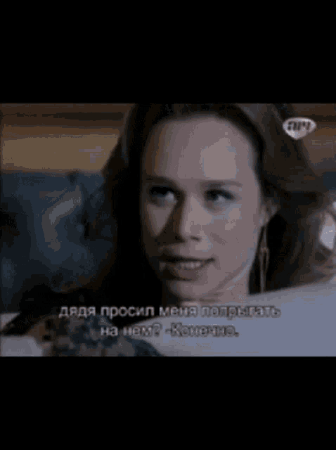a woman is talking to a man in a foreign language on a tv show