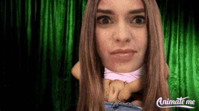 animate me shows a woman 's face with a green curtain behind her