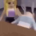 a girl in a purple top is laying on a bed next to a boy in a blue sweater .