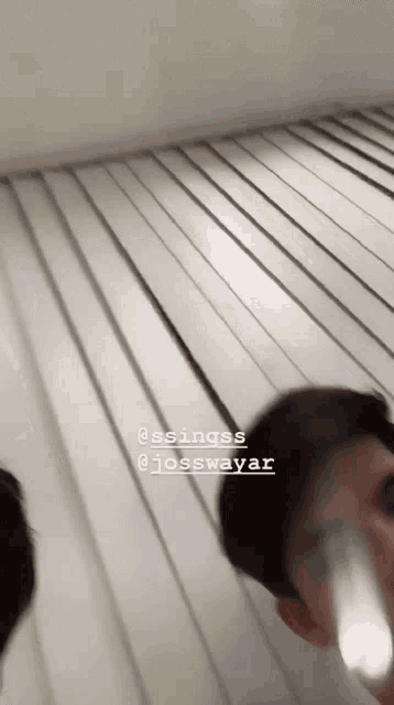 two men are standing next to each other and one has the name josswayar written on his face