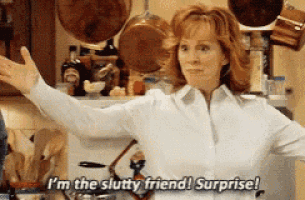 a woman in a kitchen says i 'm the slutty friend surprise !