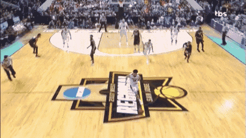 a basketball game is being played on a court with a logo that says duke