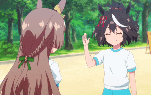 a girl giving a high five to another girl in a white shirt