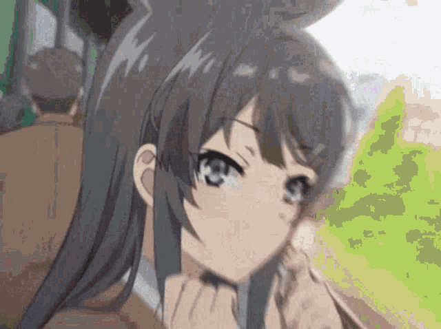 a close up of a girl 's face with a rabbit ear .