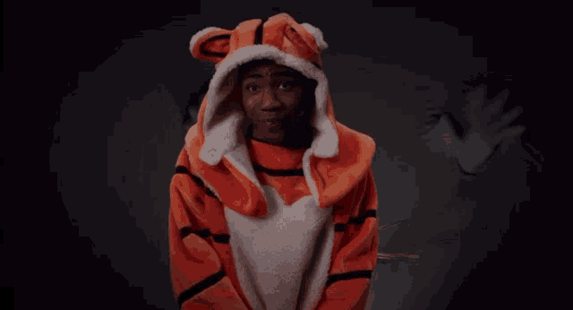 a man in a tiger costume is standing in front of a ghost