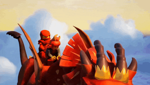 two lego characters are riding a red dragon in the sky
