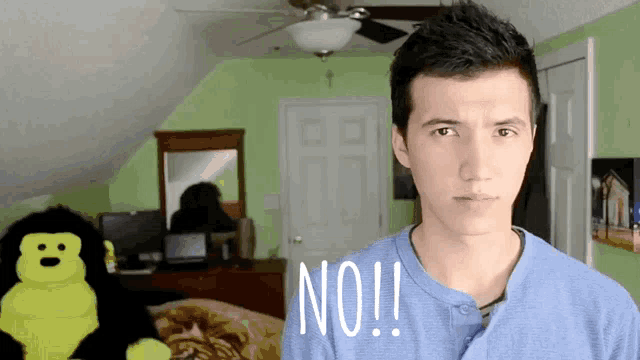 a man says no in front of a stuffed animal