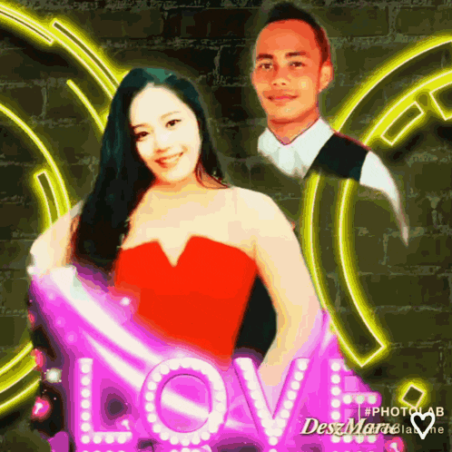 a woman in a red dress is standing next to a man in front of a neon sign that reads love