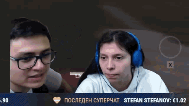 a man is kissing a woman on the cheek while wearing headphones and a stefan stefanov sticker