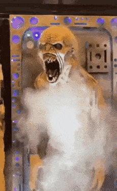 a monster with its mouth open and smoke coming out of it is standing in a room .
