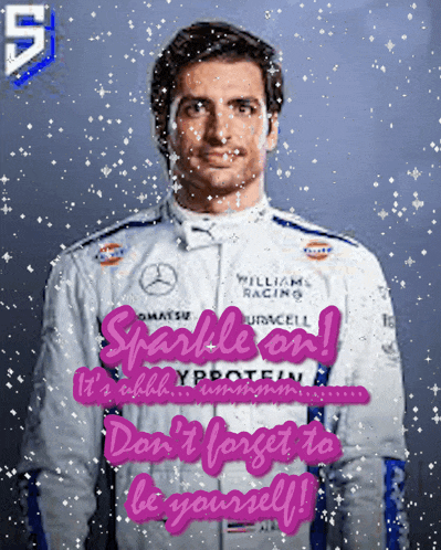 a man in a williams racing jacket is surrounded by snowflakes