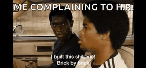a couple of men are sitting in a car and one of them is complaining to the other .