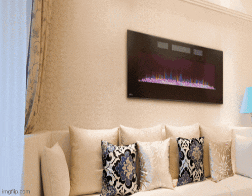 a living room with a fireplace on the wall and a couch