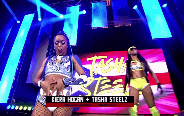 kiera hogan and tasha steelz are performing on a stage