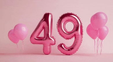 the number 49 is made of pink balloons and is on a pink background .