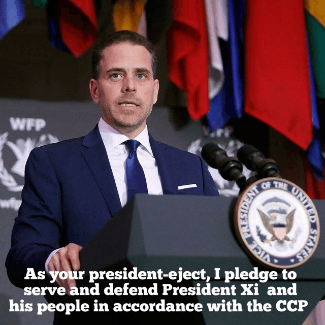 a man in a suit and tie stands at a podium in front of a united states president seal