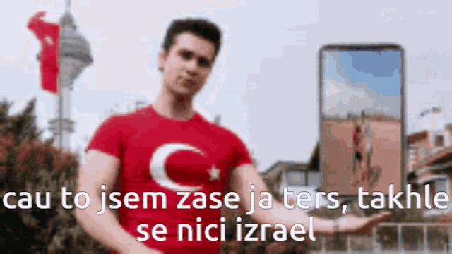 a man wearing a red shirt with a c and star on it