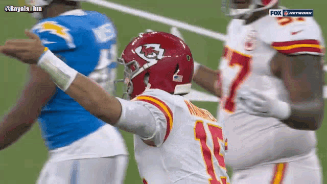 a football player wearing a red helmet with the number 7 on it