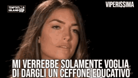 a close up of a woman 's face with the words temptation island vip written above her