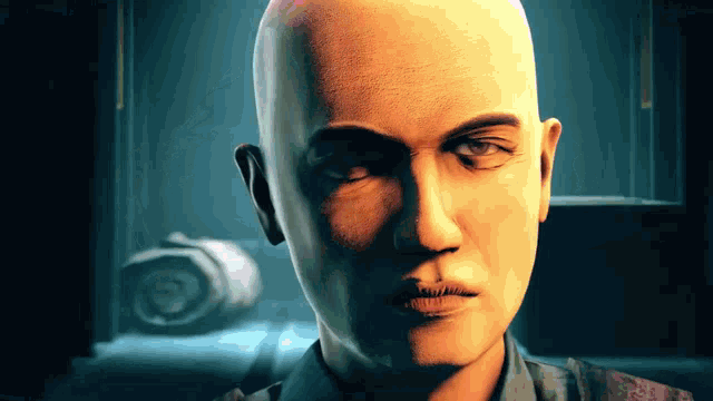 a close up of a bald man 's face