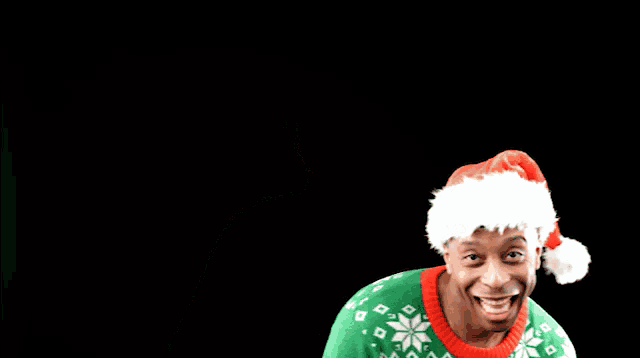 a man wearing a santa hat and an ugly sweater