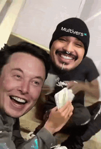 a man wearing a beanie that says multivers is smiling with another man