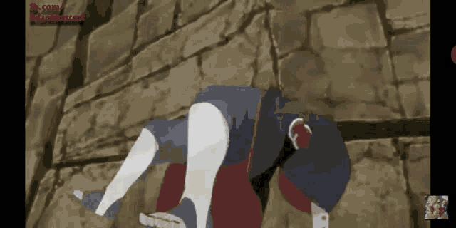 a cartoon character laying on the ground with a brick wall behind him